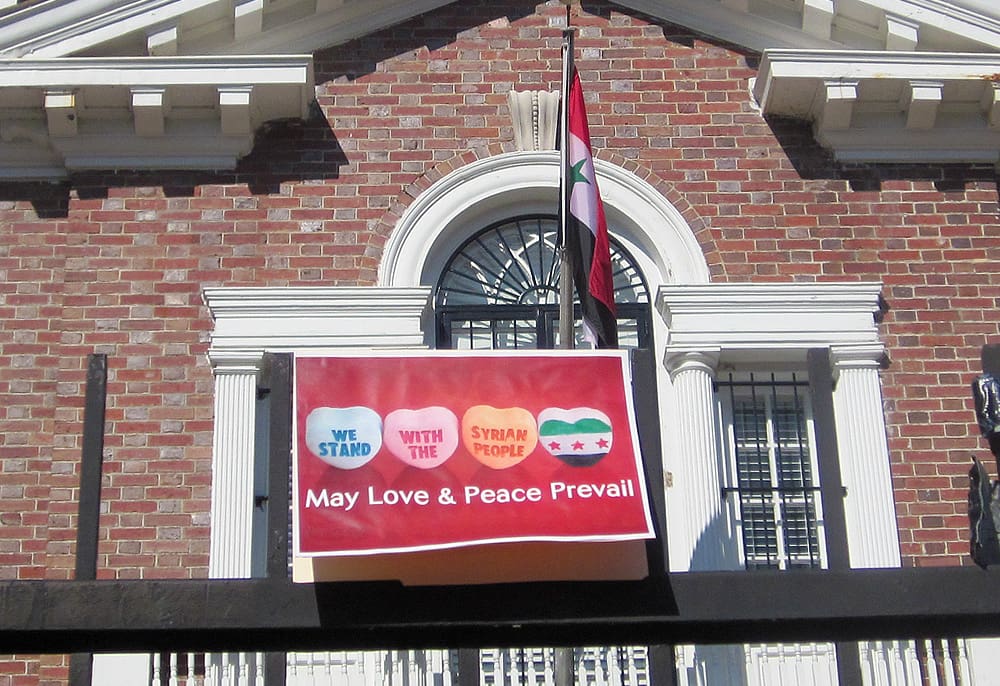 Our Valentine sits on the fence in front of the Syrian Embassy